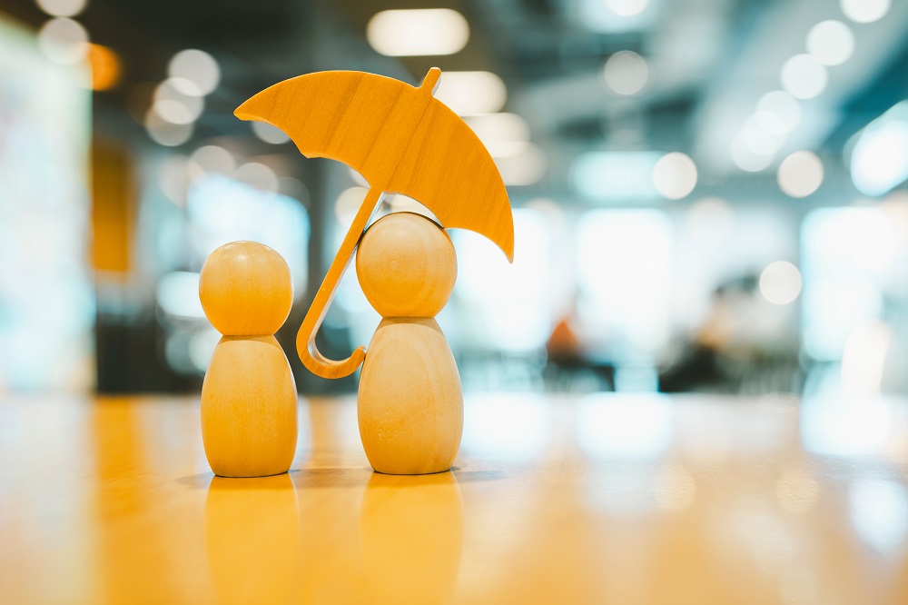 Umbrella icon and family model, Security protection and health insurance. The concept of family home, protection, health care day, car insurance.